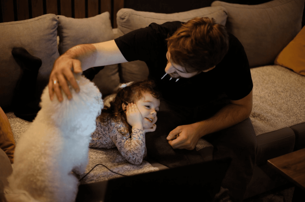 A father is talking to his young daughter briefly about her pediatric filling using calm, neutral language.