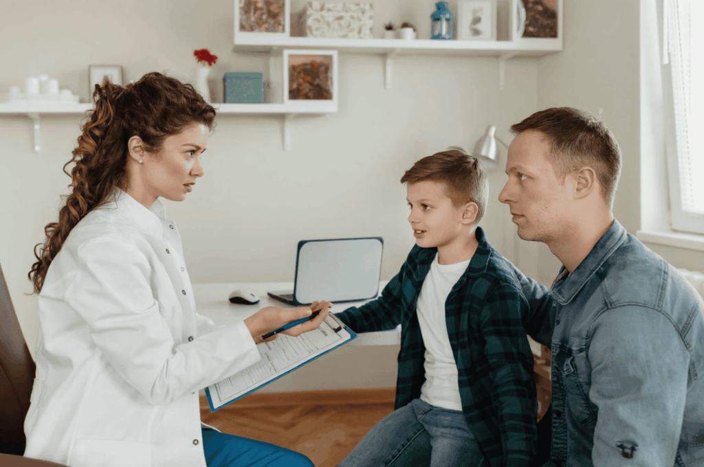 A nurse is consulting a parent about insurance for their child's upcoming dental treatment.