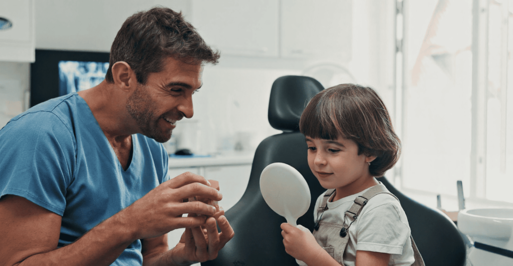 A child feels at ease during his dental procedure with a dentist he has built a rapport with.