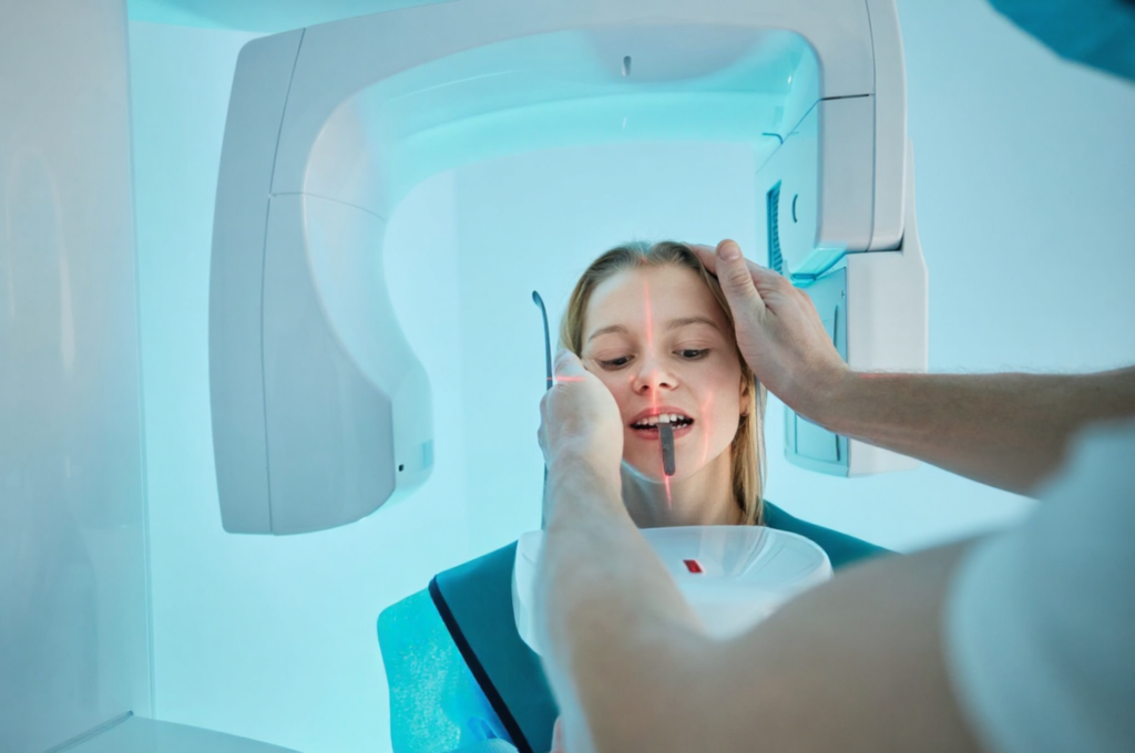 A little girl had a dental X-ray to see if a permanent tooth is present.